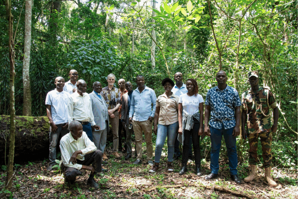 Delegation posing in front of mama Mutere, a fallen 300 year old tree ​that once served as a shrine where locals prayed for rain and good harvest.